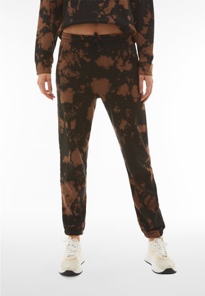 TIE DYE. - Tracksuit bottoms - black-brown