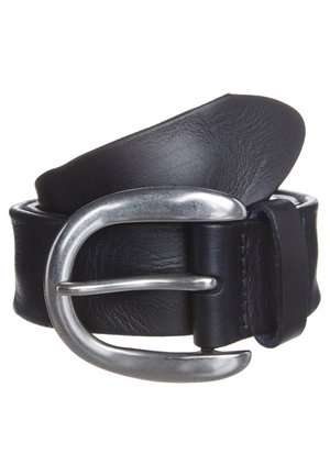 Black leather belt rolled with large silver metal buckle fastened through one hole against white background.