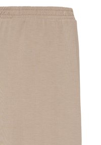 Tissu beige léger avec une texture lisse ; doté d'une taille élastique, d'un design décontracté et d'une coupe droite des jambes.