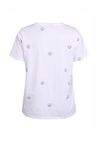 White cotton t-shirt featuring a back view with black shell patterns evenly spaced across the fabric and a crew neckline.