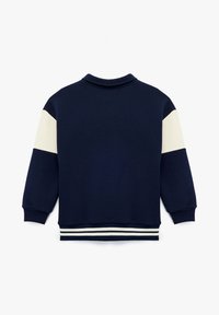 Granatowy sweatshirt z kołnierzem i brzegami w kolorze kości słoniowej i jasnoszarym. Żebrowane mankiety i kołnierz, miękka tekstura materiału.