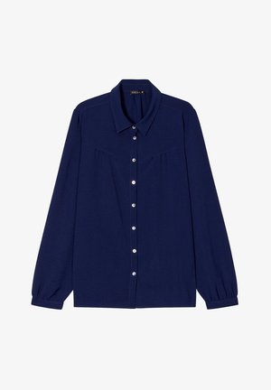 Camicia blu navy con bottoni e maniche lunghe, caratterizzata da una texture morbida, colletto e delicatiAccenti arricciati sulle spalle.