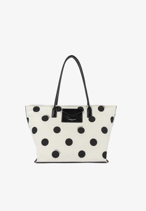 Witte draagtas met zwarte polka dots, zwarte handgrepen en een klein voorvak met het label "Lancaster Paris".
