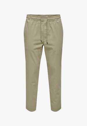 Gaiši bež jogger bikses ar elastīgu jostasvietu un auklu. Mīksts kokvilnas materiāls, sašaurinātu kāju dizains un bez kabatām.