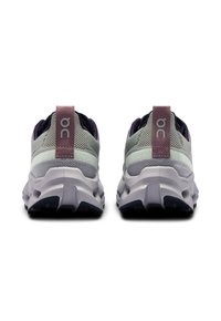 Gray and lavender athletic shoes feature a mesh upper, textured heel tab, and a thick, cushioned sole with a patterned tread.