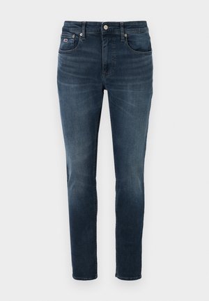Jeans en denim bleu foncé avec une coupe slim, design à cinq poches, légère décoloration et fermeture à bouton. Présente un petit logo sur la poche avant.