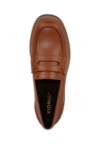 Brown leather loafer with a stitched design, featuring a flat sole and a decorative strap across the vamp. Interior is dark with branding.