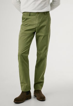 Green cotton trousers with a flat front, zipper fly, and button closure. Features side pockets, a smooth texture, and a straight leg design.