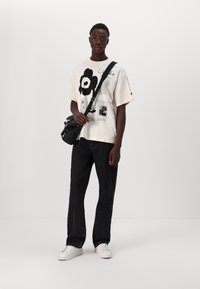 Marimekko NOPEUS UNIKKO UNISEX - T-shirts print - off white