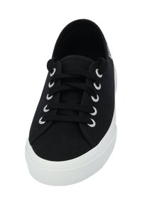 Black canvas sneaker with white rubber sole, round toe, and silver eyelets for laces. Smooth texture with minimal branding on the side.