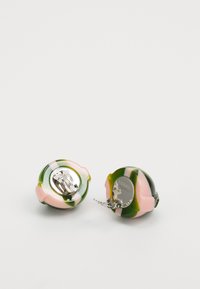 Colorful ceramic earrings shaped like rounded flowers in pink, green, and white with a silver clip-on backing.