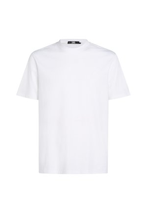 Valge lühikeste varrukatega T-särk, mis on valmistatud puuvillast. Omab ümmargust kaelust ja peent tikandiga logo rinnal. Sile tekstuur.