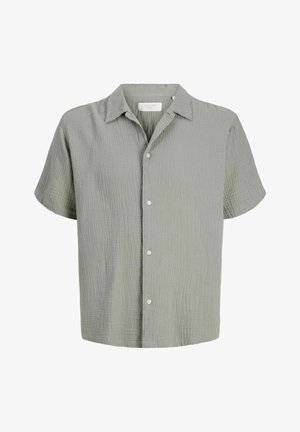 Svetlosivé textúrované bavlnené tričko s krátkym rukávom, golierom a bielymi gombíkmi na prednej strane.