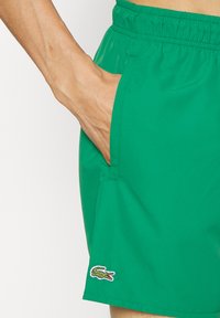 Lacoste Plaukimo šortai - rocket/green