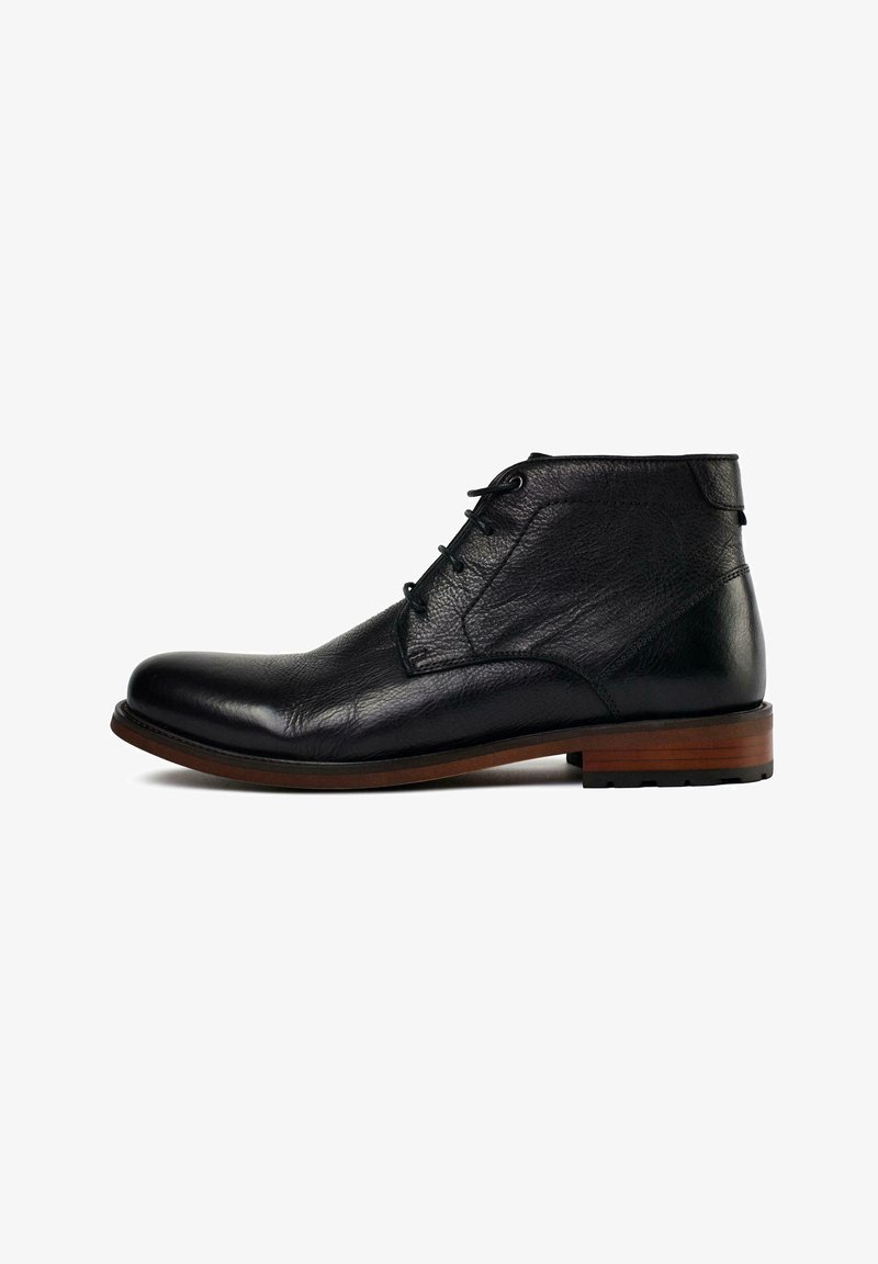 Black leather ankle boot with a rounded toe, subtle texture, lace-up front, and a wooden heel. Slightly elevated sole for added comfort.
