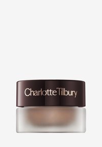 Charlotte Tilbury cream in a clear glass jar with a frosted finish. The lid is dark brown with gold lettering. Compact, round design.
