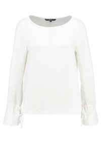 Long-sleeve white top with a round neckline and gathered sleeves, featuring drawstring details at the cuffs. Textured fabric.