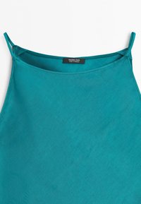 Teal sleeveless top with thin shoulder straps and a straight neckline, featuring a "Massimo Dutti Made in Morocco" label inside.
