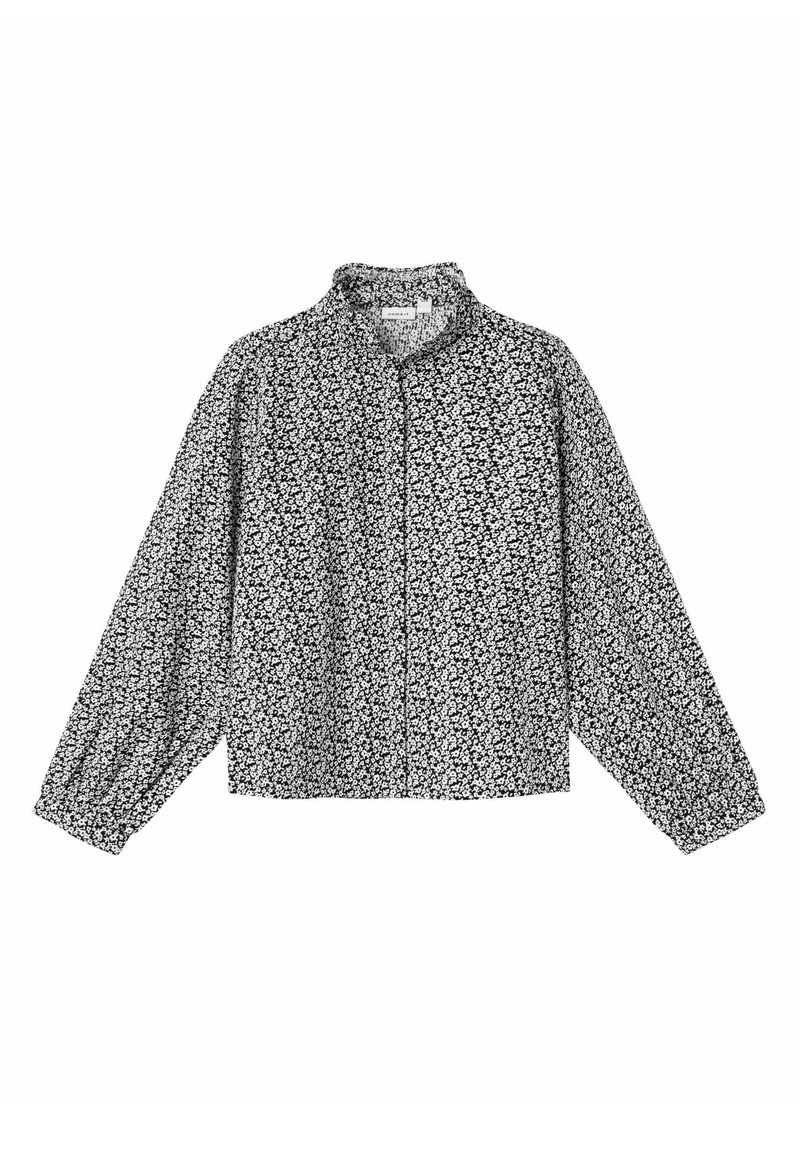 Blusa a maniche lunghe bianca e nera con motivo floreale, colletto rotondo, chiusura con bottoni e polsini elasticizzati. Tessuto leggero.