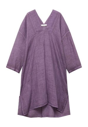 Purple linen tunic with a V-neck, three-quarter sleeves, and an asymmetric hem. Texture appears soft with a lightweight design.