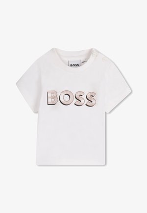 Hvid t-shirt til spædbørn med korte ærmer, to trykknapper på skulderen og "BOSS" trykt med store brune kontur-bogstaver på forsiden.