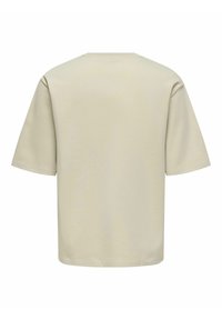Lysebeige t-shirt med korte ærmer, rund halsudskæring og afslappet pasform. Fremstillet af blødt stof med en glat tekstur uden synlige mønstre.