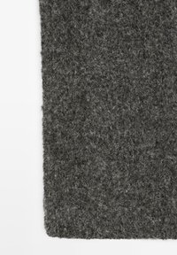 Grey felt textile with a dense, textured surface and soft fibers, cut in a rectangular shape with slightly rounded corners.