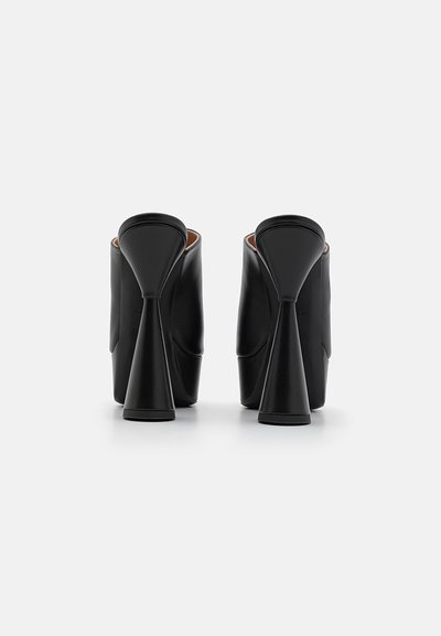 Black leather high-heeled shoes with a unique conical heel design and smooth texture, featuring a closed back and rounded opening.