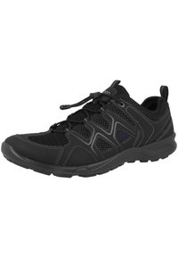Black athletic shoe with mesh and synthetic material, features a curved toe, textured sole, elastic laces, and accent stitching.