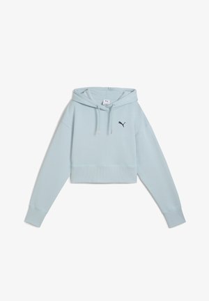 Light blue cropped hoodie made of soft fabric, featuring a front kangaroo pocket, drawstring hood, and navy logo on the left chest.