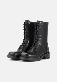 Black leather ankle boots with a rounded toe, lace-up front, and zipper closure. Chunky heel and textured upper detailing.