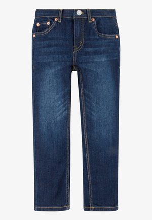 Jean bleu foncé à coupe droite avec rivets en cuivre, bouton devant, fermeture éclair et style cinq poches.