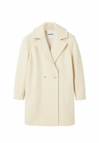 Manteau croisé de couleur crème en tissu texturé et duveteux. Comprend un col cranté et deux poches avant.