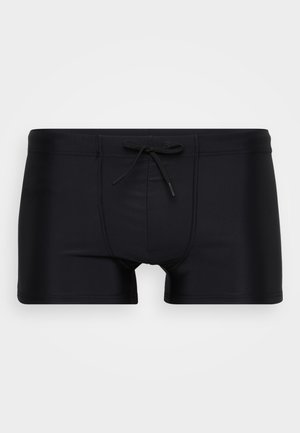 Black swim trunks with a fitted design, drawstring waistband, and smooth textured fabric. Notable front seam detail enhances fit.