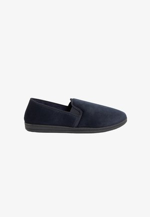 Scarpa slip-on navy con parte superiore in tessuto texturizzato e suola in gomma nera. Presenta un profilo basso e lati elastici per una facile indossabilità.