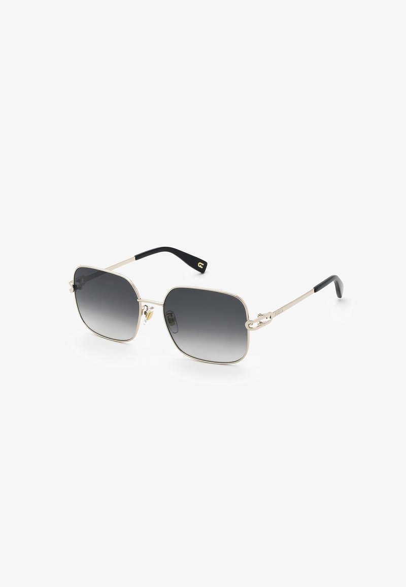 Lunettes de soleil carrées avec verres dégradés foncés, montures métalliques fines dorées et embouts de branches noirs.
