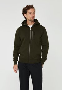 Tmavě zelená mikina na zip, vyrobená z bavlněné směsi, s přední kapsou na zip, žebrovanými manžetami a velkou kapucí.
