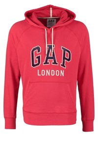 Sweat à capuche rouge en mélange de coton, avec une poche avant, une capuche à cordon, et le texte "GAP LONDON" en lettres bleues et blanches.