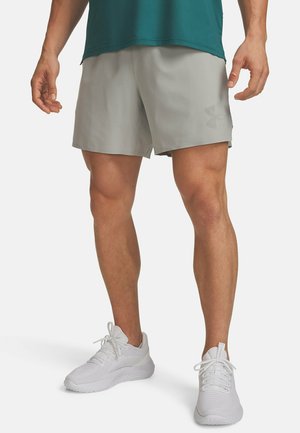 Light gray athletic shorts with a side logo, made of breathable fabric, paired with white running shoes, standing on a plain background.