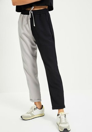 Pantalones deportivos - black