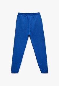 Blå sweatpants lavet af blødt stof, med en elastisk talje og manchetter, med et enkelt, uden pyntedesign.