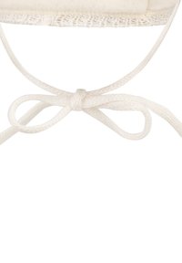 Cotton face mask with a soft beige exterior, featuring a looped tie closure. The design includes a textured trim along the top.