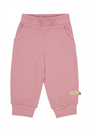 Roze broek van waffle-textuur met een zachte tailleband, zijzakken en geribbelde boorden. Heeft een groen merklabel aan de zijkant.