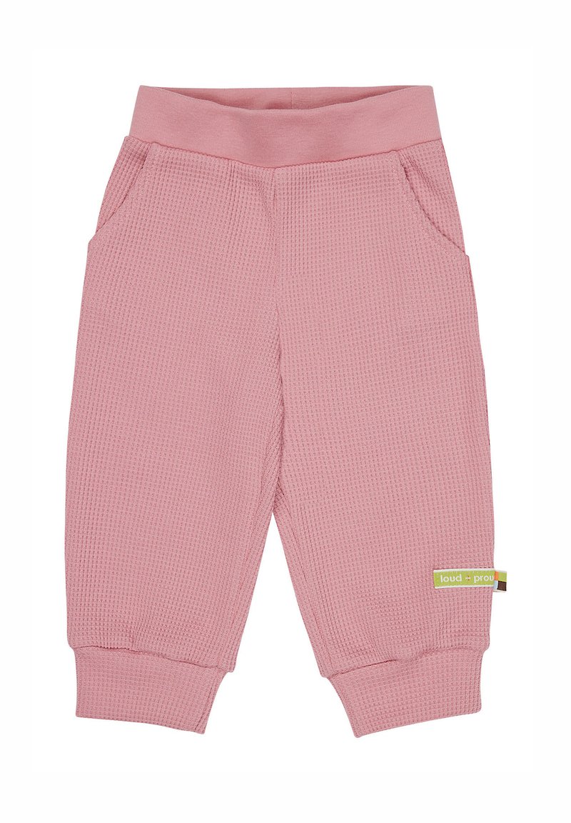 Roze broek van waffle-textuur met een zachte tailleband, zijzakken en geribbelde boorden. Heeft een groen merklabel aan de zijkant.