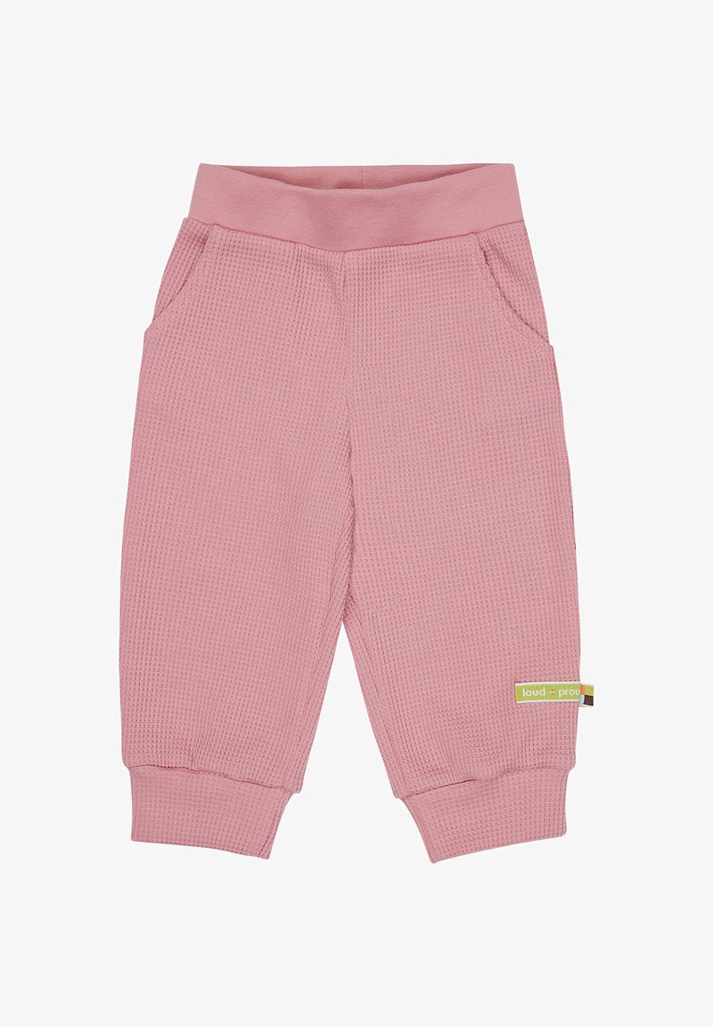 Roze broek van waffle-textuur met een zachte tailleband, zijzakken en geribbelde boorden. Heeft een groen merklabel aan de zijkant.