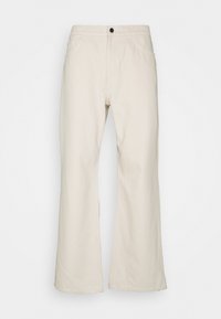 Béžové kalhoty s širokými nohavicemi z bavlny, vybavené zapínáním na knoflíky, předními kapsami a čistým lemem. Hladká textura s minimem švů.