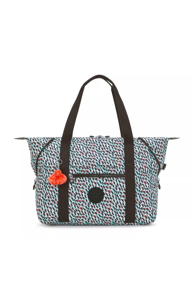 Patterned duffel bag with a light blue, red, and black design. Features black handles, zippered pockets, and a pom-pom charm as an accent.