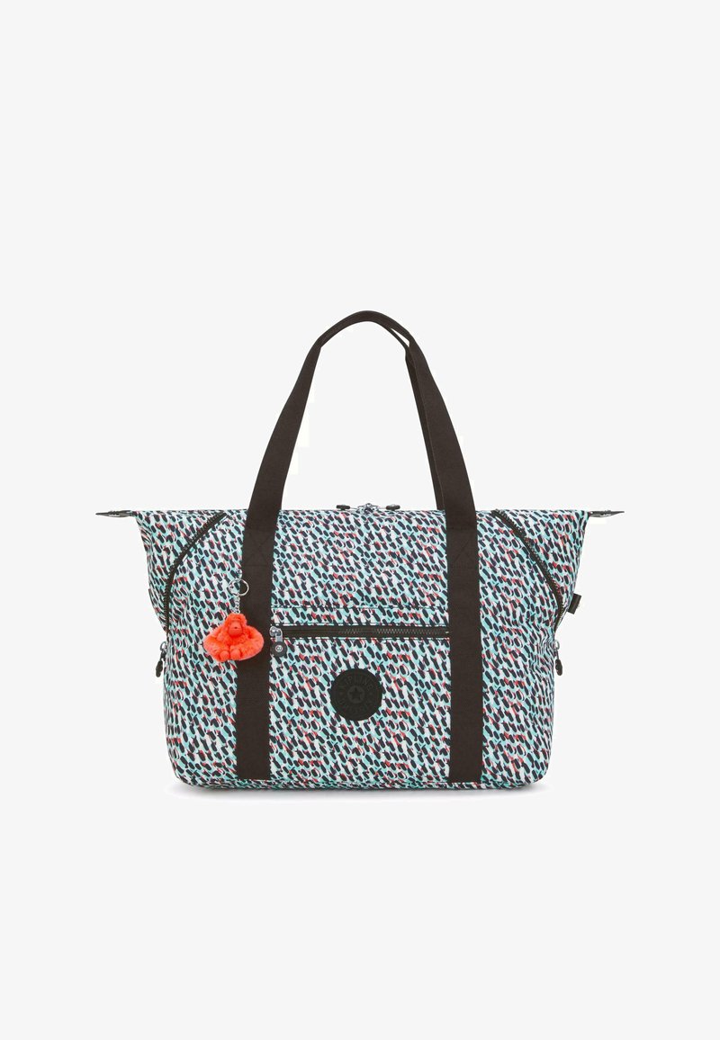 Patterned duffel bag with a light blue, red, and black design. Features black handles, zippered pockets, and a pom-pom charm as an accent.