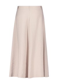 Jupe beige clair à design évasé, fabriquée en tissu doux. Dotée d'une taille lisse et sans motifs ou accents prononcés.