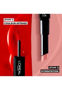 Produit pour les lèvres L'Oréal Paris avec une pointe applicateur rouge à gauche et un design élégant noir et argent, montrant un contenant de baume à lèvres rose à droite.